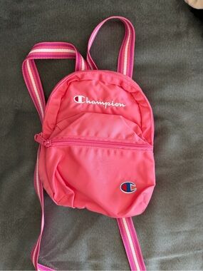 champion mini backpack pink Kids' Merit and dual side mesh pockets hold a water bottle so spills stay out of the bag Kids' Merit Backpack – Champion